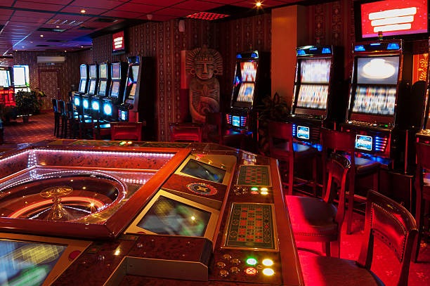 manggatoto login Live Game Shows presenter in studio with spinning wheel and multi-camera feed